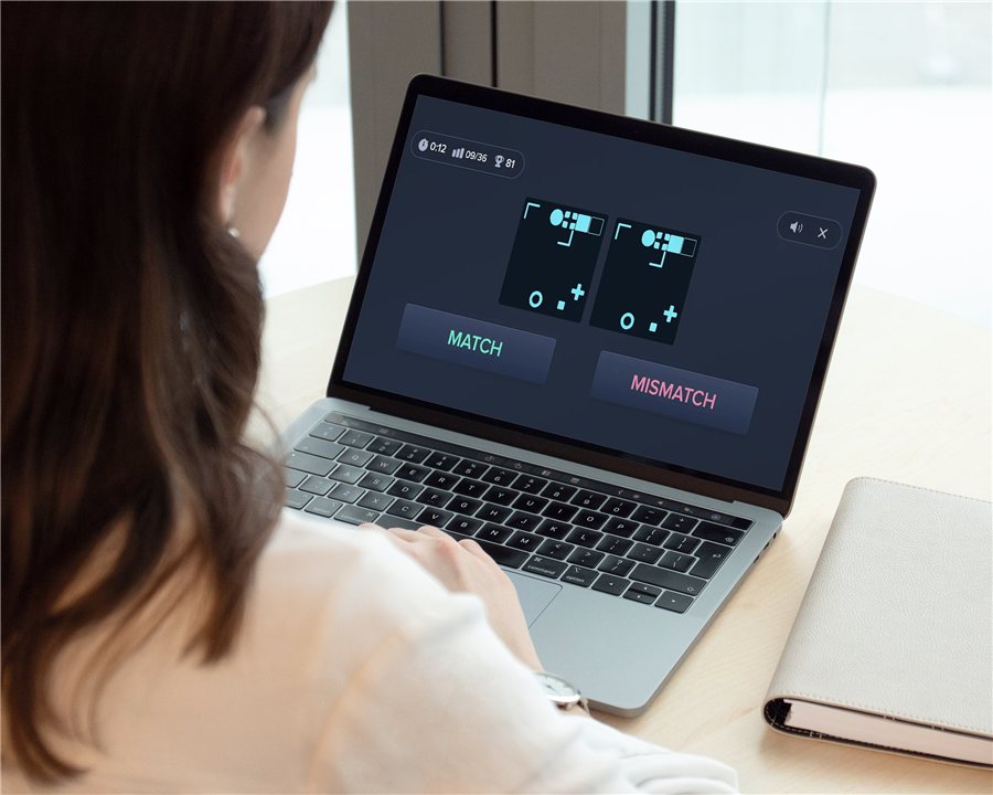 A patient completing a computerized cognitive task on a laptop